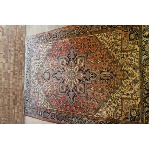 333 - An Antique Rust Blue floral bordered central medallion all over patterned Persian carpet. Measuring ... 