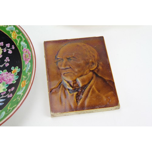 581 - A Victorian pottery tile depicting an elderly gentleman, two Chinese plates, hors d'oeuvres dish, et... 