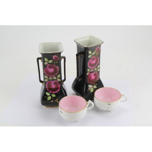 591 - A Pair of Black Floral Painted Vases 