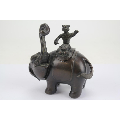 674 - Chinese Bronze Study of an Elephant with a Young Attendant Banging Drums.