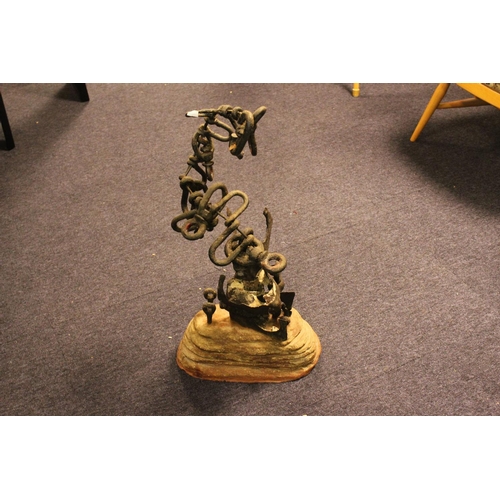 683 - A Contemporary Iron and Link Made Candelabra on Rustic Stand.