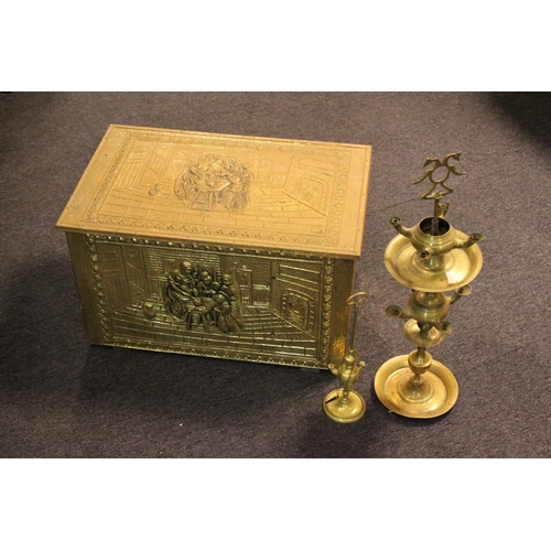 697 - Two Indian brass oil burners with reservoirs on stands and a Dutch brass log bin decorated with figu... 