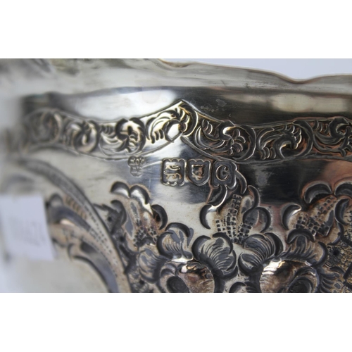 66 - A Victorian Silver Rose Bowl with Embossed Decoration Resting on Pedestal Base, London C. Weighing 2... 