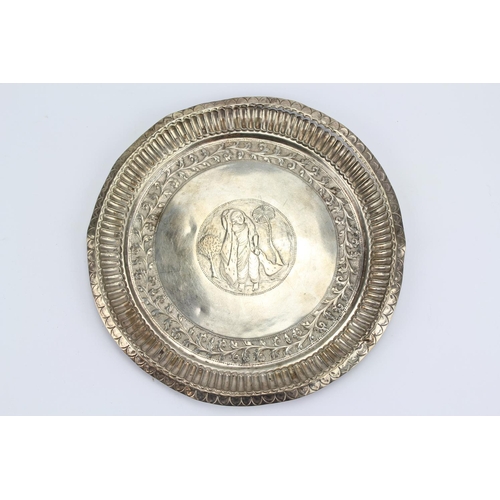 68 - An Indian Silver Floral Embossed Edged Salver Decorated with a Washer Woman. AF. Weighing 247 Grams.