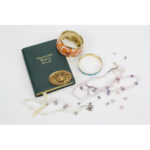 481 - A Travellers world atlas book, a cap badge, two enamelled bangles and a necklace.