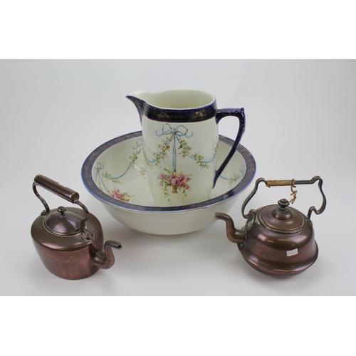 483 - Two Antique Copper Kettles and a wash basin and jug in blue glaze.