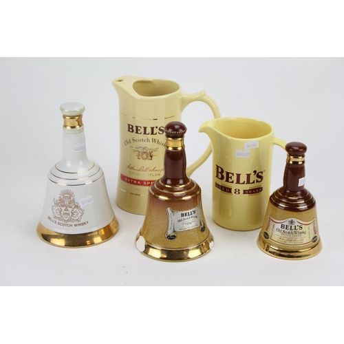 334 - Three Bell's Commemorative Decanters and Two Jugs to Match.