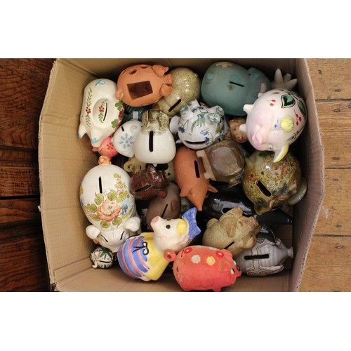 551 - A Large collection of Pottery Money Box Pigs to include brown glazed pigs, floral pattern, etc