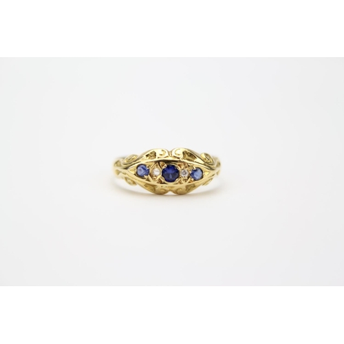 105 - An 18ct Gold Ring, Set with Three Sapphires and Two Diamonds. Total Weight: 2.3 grams, Size P.