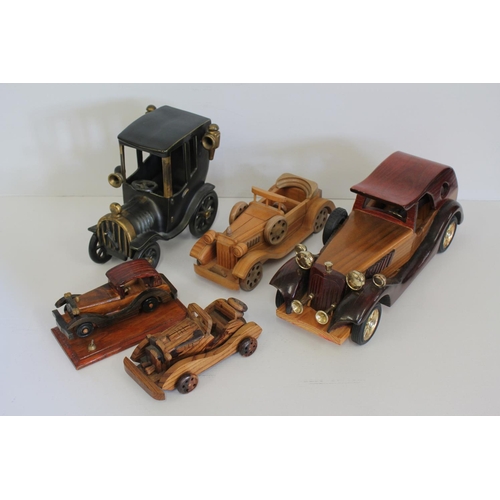 326 - A Collection of 5 model cars to include 4 in Wood & 1 in Cast Iron.