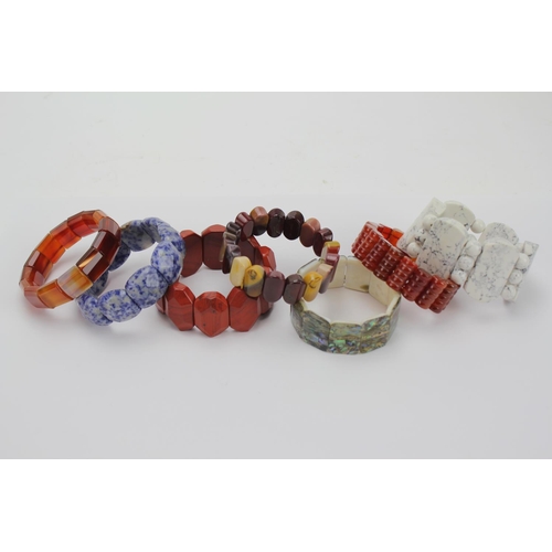 73 - A Collection of Hardstone Bangles, Agate, Mop, etc.