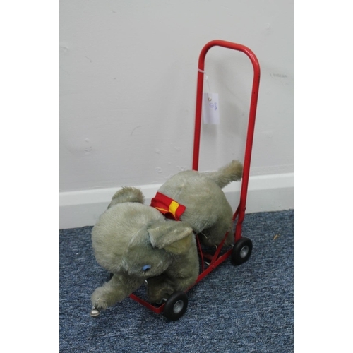 398 - A Scarce Pedigree (Northern Ireland) Push-A-Long Elephant Soft Toy with Pedalling front legs in fade... 