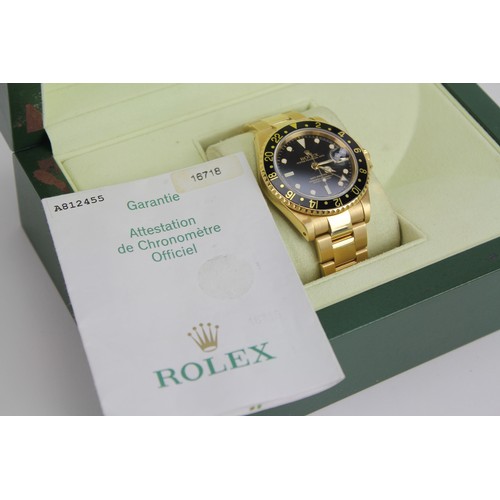 103 - A Rolex GMT-Master II in 18k Yellow Gold, Oyster Perpetual, Gents Wristwatch. Black dial with date a... 