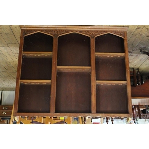 335 - A Victorian pine hanging sectioned wall shelves  with shaped top. Measuring: 123cms long x 109cms hi... 