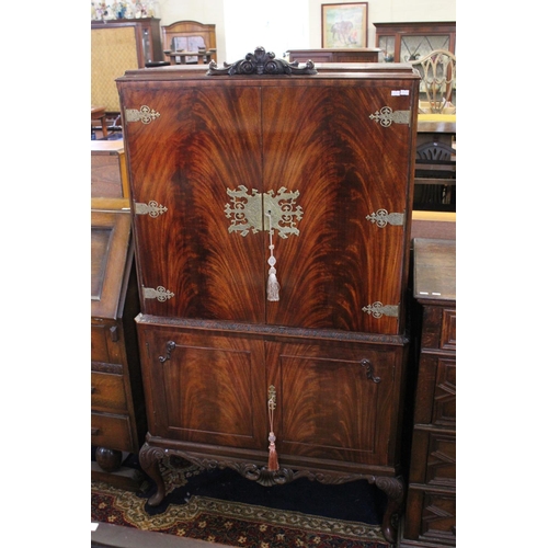 442 - A 1950's Flame Veneered & Brass Mounted Cocktail Cabinet with fitted interior. Measuring: 48cms deep... 