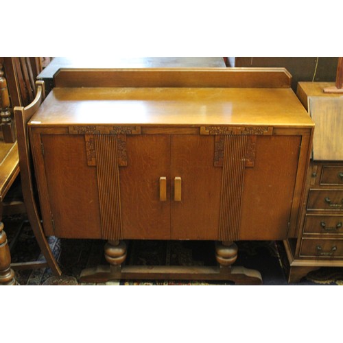 443 - A 1920's Oak Bureau with 3 fitted graduated drawers. Along with a Dinning Room Cabinet. Measuring: 9... 