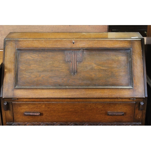 443 - A 1920's Oak Bureau with 3 fitted graduated drawers. Along with a Dinning Room Cabinet. Measuring: 9... 