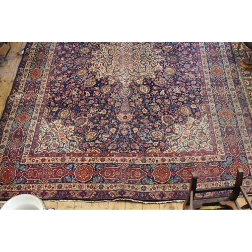 299 - A Large All Over Floral Gul Bordered Cream, Rust & Blue Corner decorated Persian Rug. Measuring: 297... 