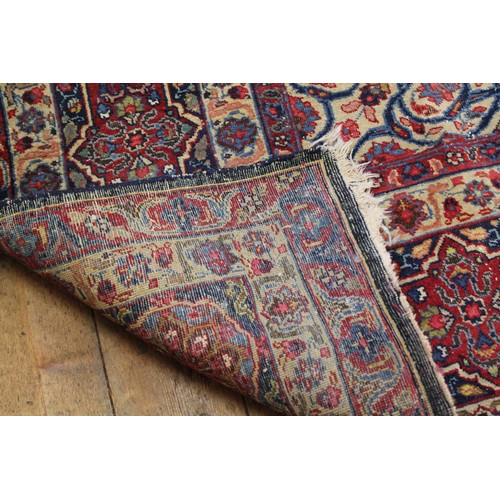 299 - A Large All Over Floral Gul Bordered Cream, Rust & Blue Corner decorated Persian Rug. Measuring: 297... 