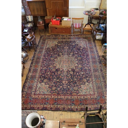 299 - A Large All Over Floral Gul Bordered Cream, Rust & Blue Corner decorated Persian Rug. Measuring: 297... 