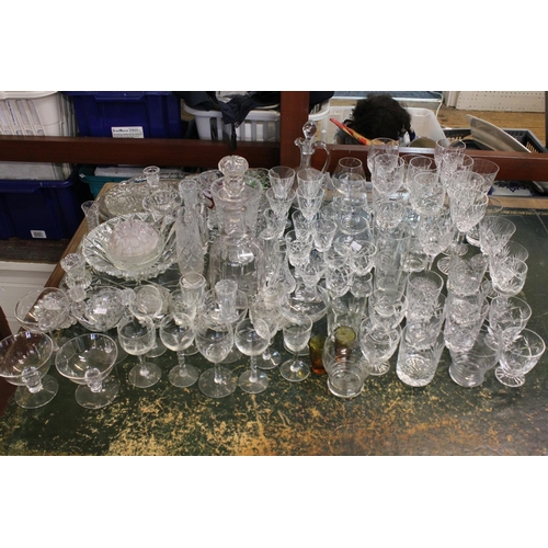 317 - A Large Collection of glass to include a Costa Cut Glass Vase, Champagne Glasses, Engraved Sherries ... 