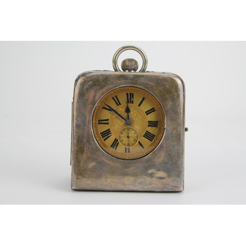 73 - A Silver Cased Bedside Case containing a Silver Plated & Gilt Metal Watch.