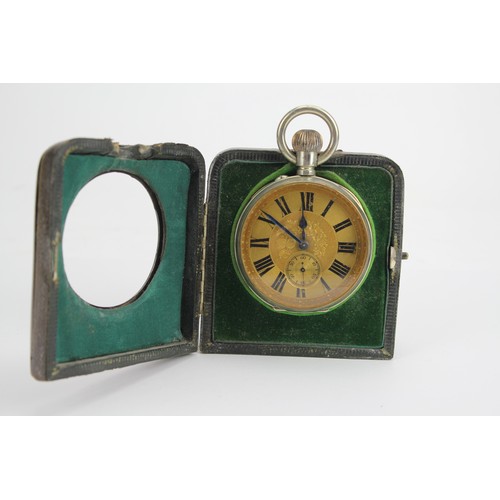 73 - A Silver Cased Bedside Case containing a Silver Plated & Gilt Metal Watch.