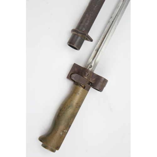 267 - A French brass handled Napoleonic era bayonet of square construction outer mounted metal scabbard.