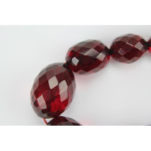 131 - A Red Beaded Necklace with Faceted Shape and Form.