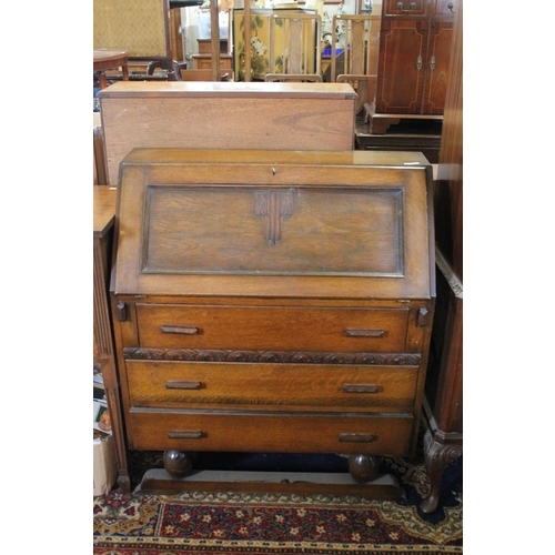 443 - A 1920's Oak Bureau with 3 fitted graduated drawers. Along with a Dinning Room Cabinet. Measuring: 9... 