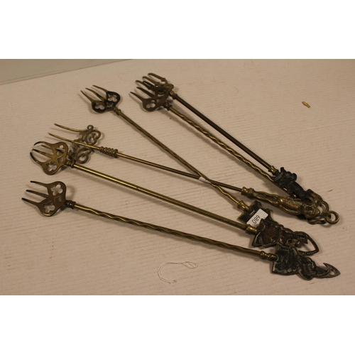 163 - A Collection of Brass Toasting Forks.