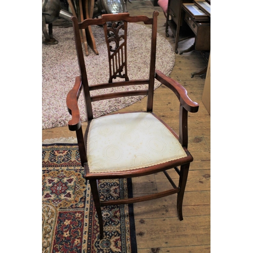 75 - A late 19th century Drawing Room elbow chair with carved back.