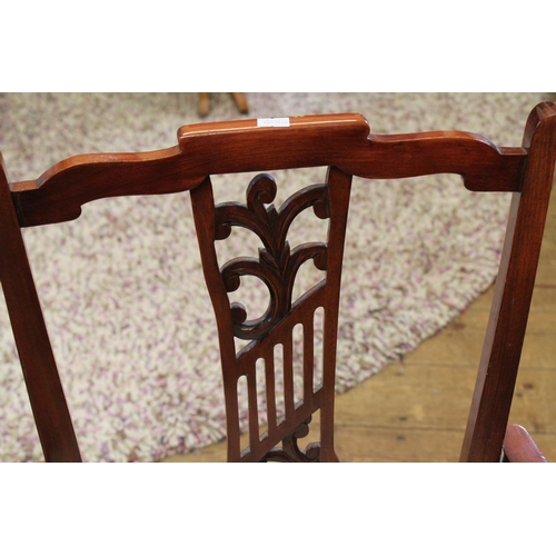 75 - A late 19th century Drawing Room elbow chair with carved back.