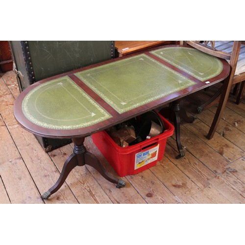 69 - A Dark Oak Coffee Table with Green Leather inlay. Measuring: 120cms Long x 40cms Wide x 53cms High.