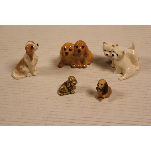 530 - A Beswick Study of a King Charles Spaniel, two Beswick Puppy Dog Groups, etc.