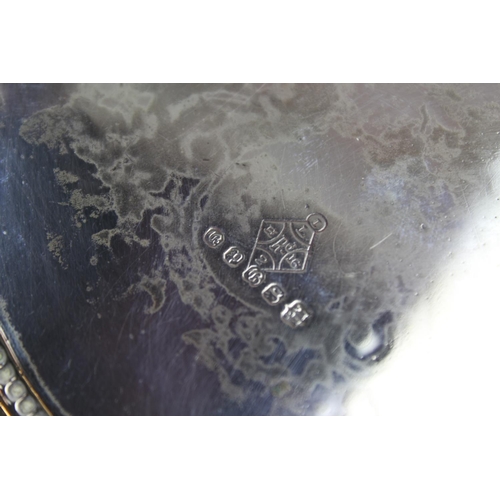 58 - A Victorian embossed & chased Brittany Metal Biscuit Barrel along with a plated scalloped salver.