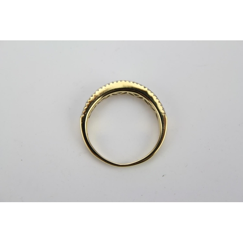 68 - A Ladies (750) Gold Dress half eternity Ring set with three rows of graduated Diamonds. Size: N, Wei... 