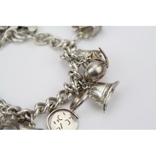 146 - A Silver Charm Bracelet to include a House, Helmet, Church, Horse Shoe, Rocking Chair, etc. Total We... 