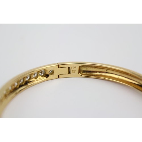 58 - A Beautiful 18ct Gold Diamond Set Bangle. Total Diamonds: 27 Brilliant Cut. Previous Valuation by Mi... 