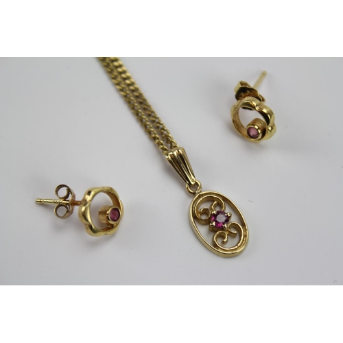 66 - A 9ct Gold chain with pendant and a pair of earrings set with Rubie's. Weighing: 5.3 grams.