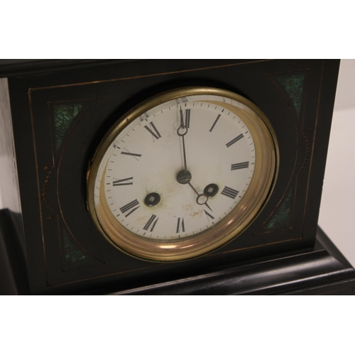 196 - A Late 19th Century Malachite & Slate Drawing Room Clock with enamelled Dial & Key.