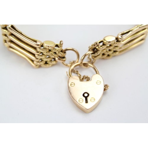 71 - An Antique 15ct Gold 4 bar gate bracelet with heart shaped locket. Weighing: 16 grams.