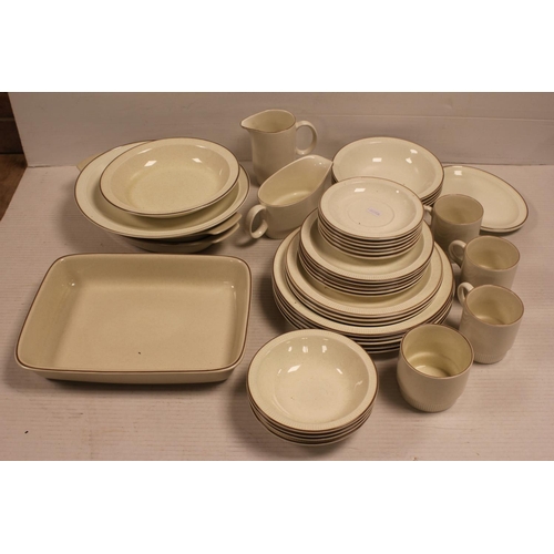 472 - A Collection of Poole Pottery to include: Large Dinner Plates, Side Plates, Saucers, Cups, Jug, Ture... 