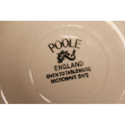 472 - A Collection of Poole Pottery to include: Large Dinner Plates, Side Plates, Saucers, Cups, Jug, Ture... 