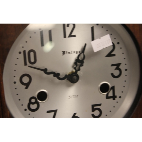 134 - A Modern Reproduction Wall Clock (Vintage 31 Day).