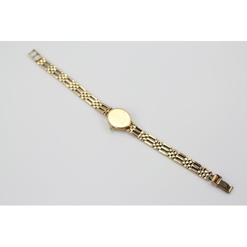 108 - A Ladies 9 carat Gold Rotary Wristwatch with white enamelled dial. Total Weight: 16.9 grams.