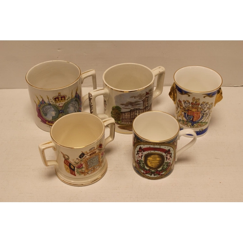 448 - A Queen Victoria two handled Osborne House Record Rain Loving Cup, A Mighty Empire 1897 Mug, etc.