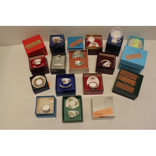 451 - A Collection of Worcester, Coal port and other collectors miniature cups and saucers. All Boxed.