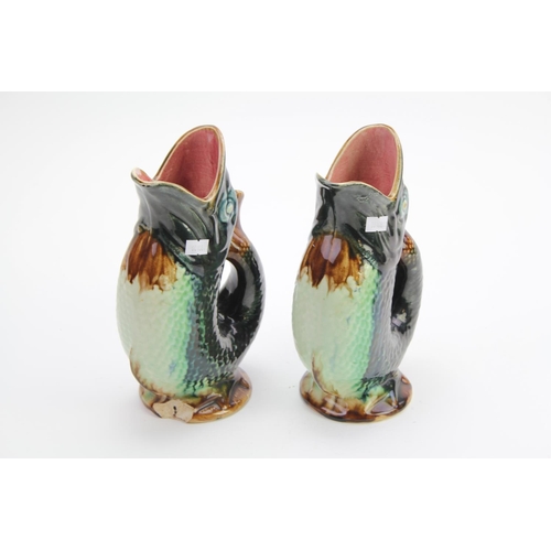 460 - A pair of Belgium pottery jugs designed as fish.