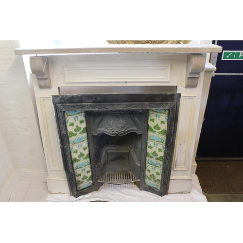 536 - A Late 19th Century tile mounted fire place with surround. Measuring: 91 cms x 80 cms. (Fire place).